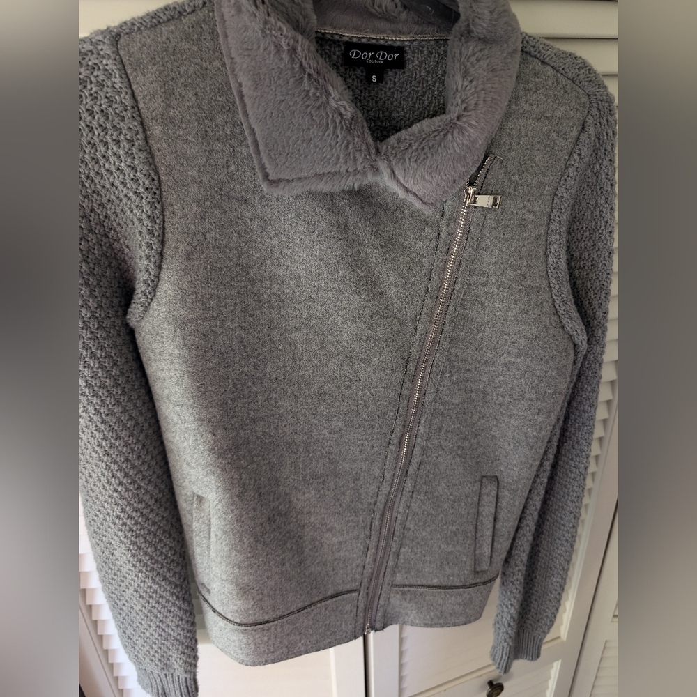 Grey zip up sweater/jacket.
